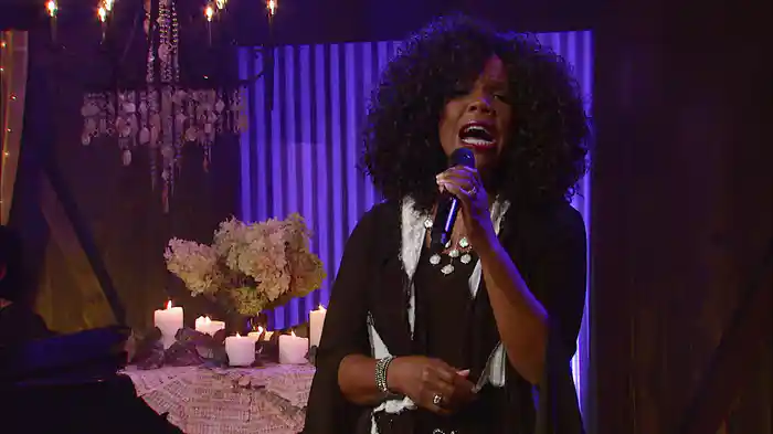 Sheltered In The Arms Of God (Live)