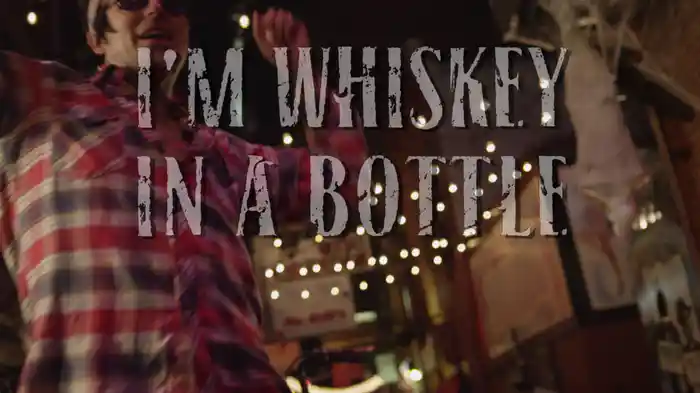 Whiskey In A Bottle (Lyric Video)